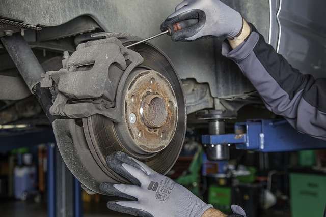 What do you look for in an auto repair shop? - Mechanic working on car brakes