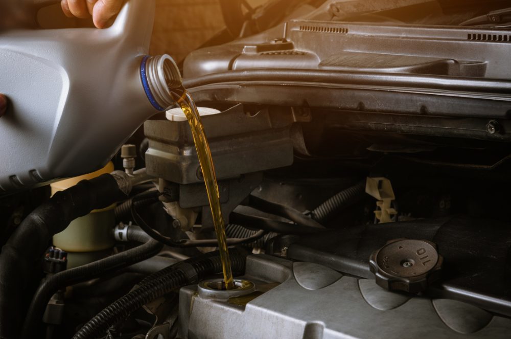 Oil Change Specials - mechanic performing an oil change